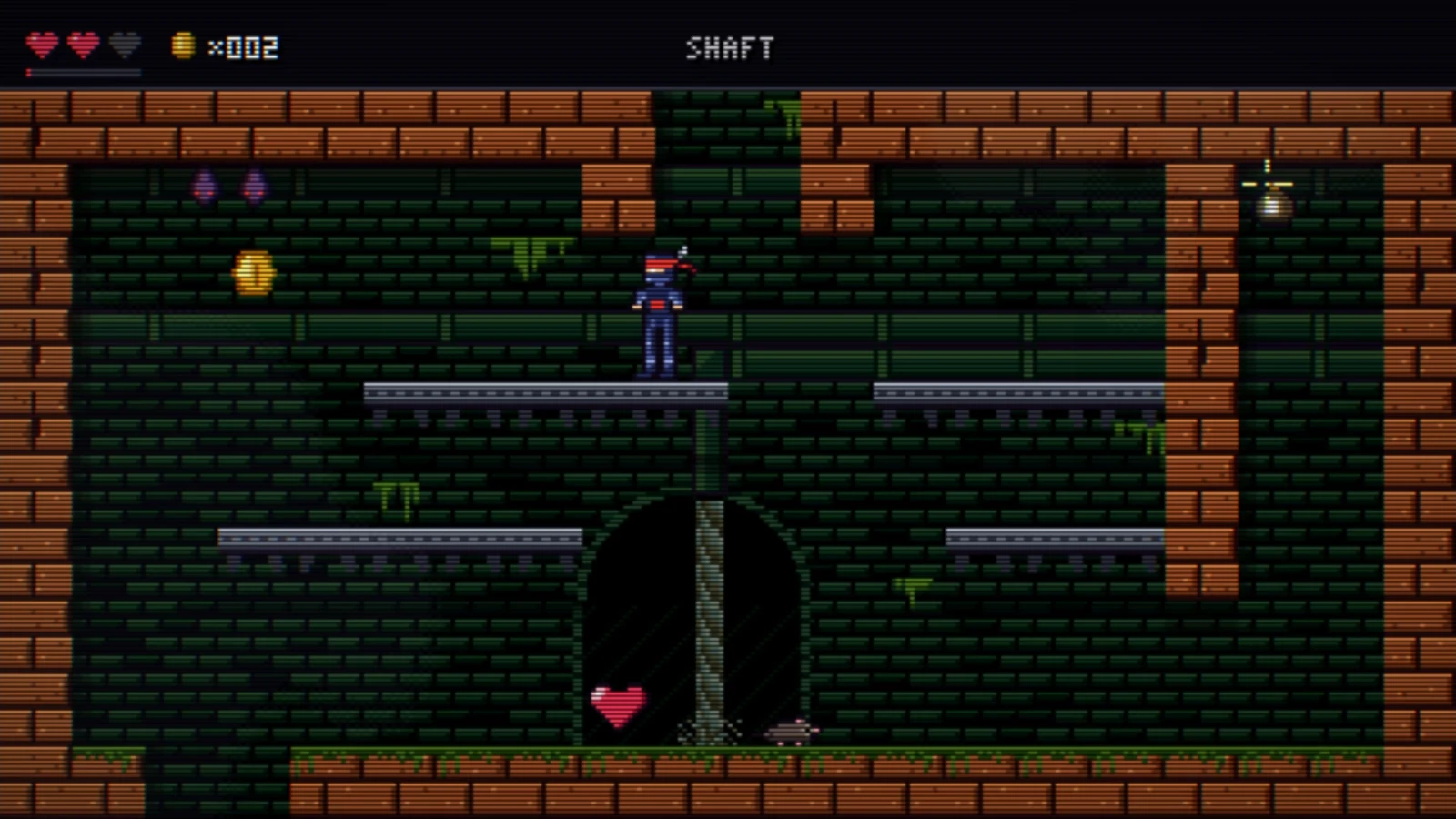 The ninja on a metal platform in the Shaft, a room of green bricks framed by orange ones, with a coin up on the left and a heart on the floor below.